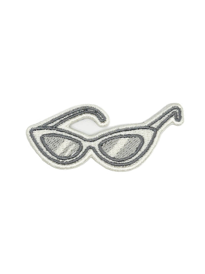 Embroidered iron-on patch of retro cat eye sunglasses in neutral tones