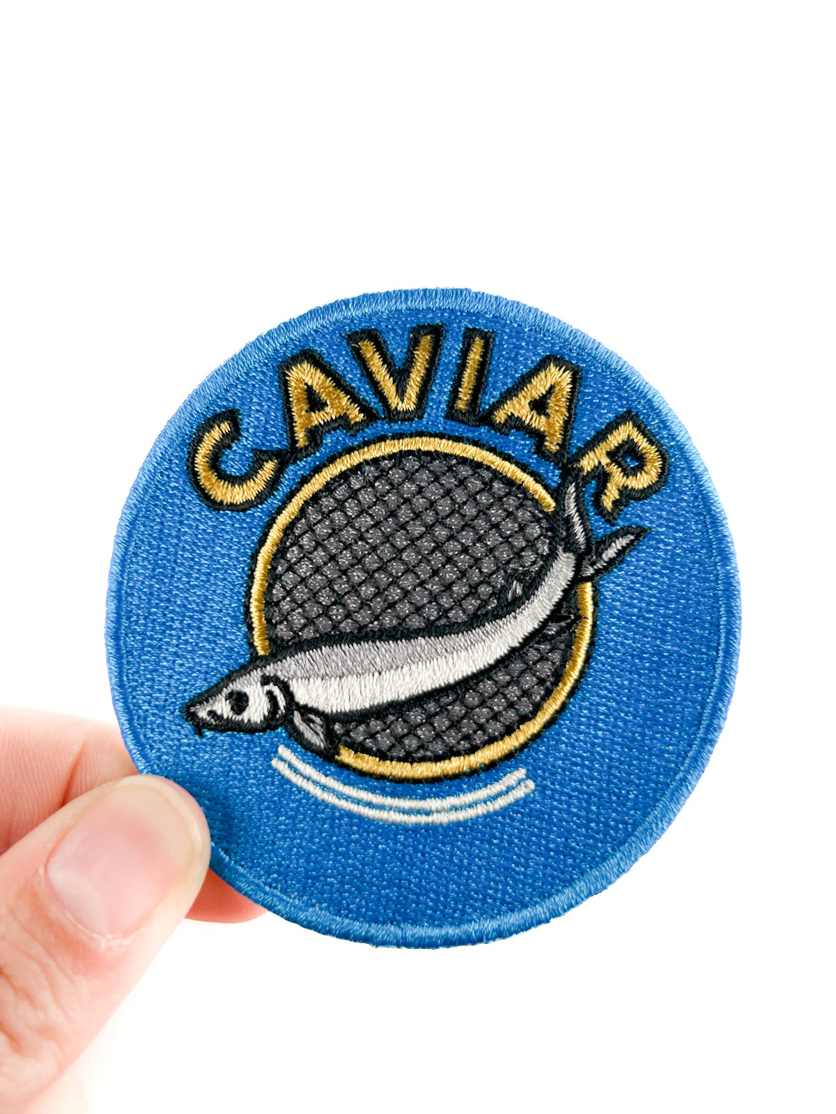 Caviar tin embroidered iron-on patch in royal blue with metallic silver and gold details
