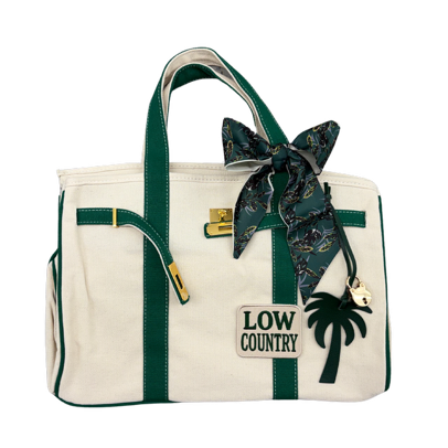 Charleston Tote Bag, a large cream canvas tote bag with green trim, green twilly scarf, gold padlock, palm tree charm and Low Country patch