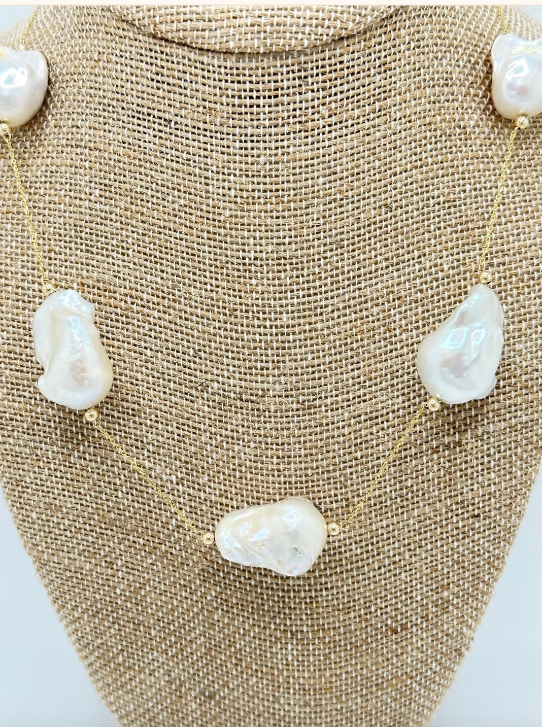 close up of gold pearl necklace