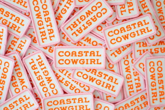 Coastal Cowgirl patch in bright orange and pink, 3 inches