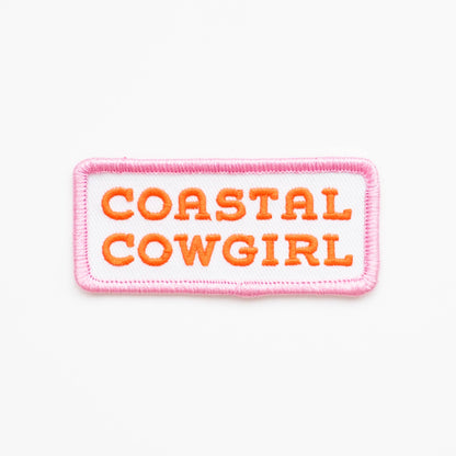 Coastal Cowgirl embroidered iron-on patch in orange and pink