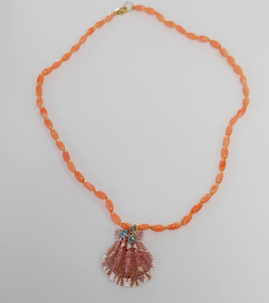 Display of Coral Necklace with shell and apatite charms.