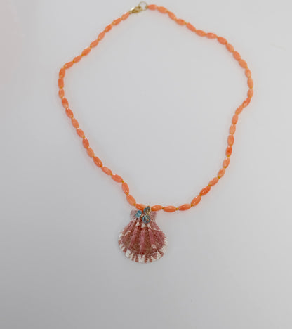 Coral Necklace featuring pink bamboo coral beads, a 14K gold-filled shell charm, and neon apatite accents