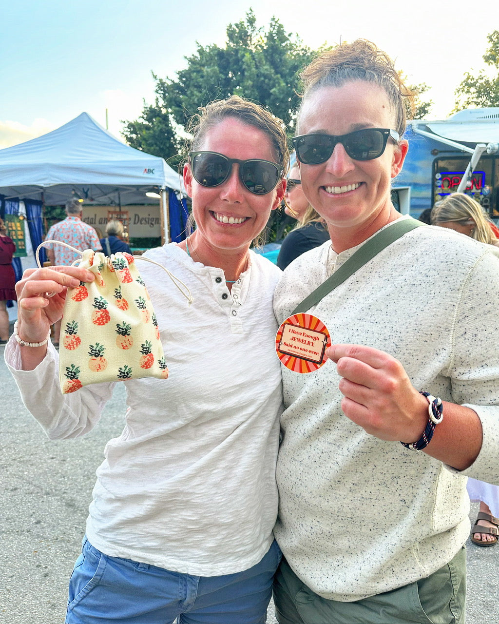 Several cheerful customers of Coral Strands, happily posing with their purchases, reflecting satisfaction and joy.