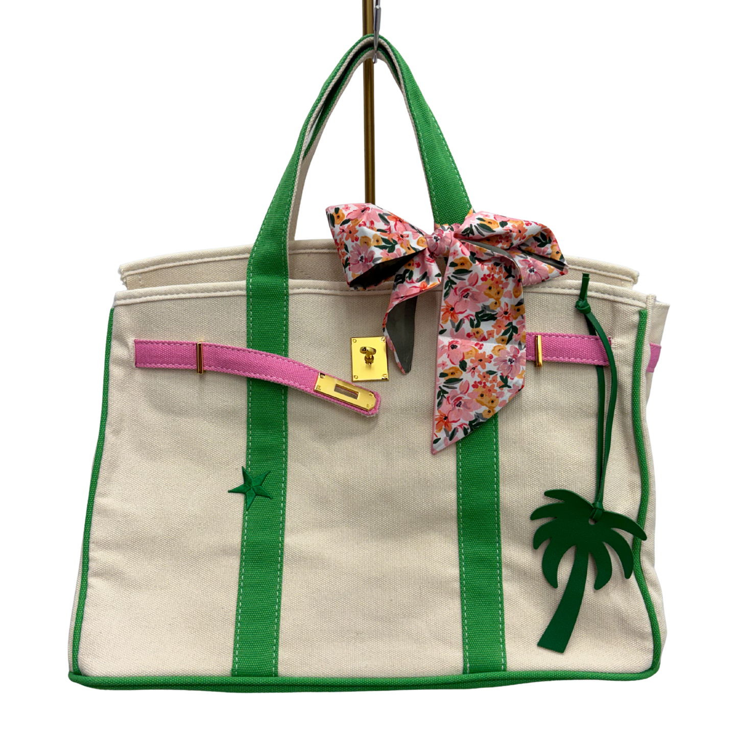 Custom Boatkin bag with pink and green trim and green star.