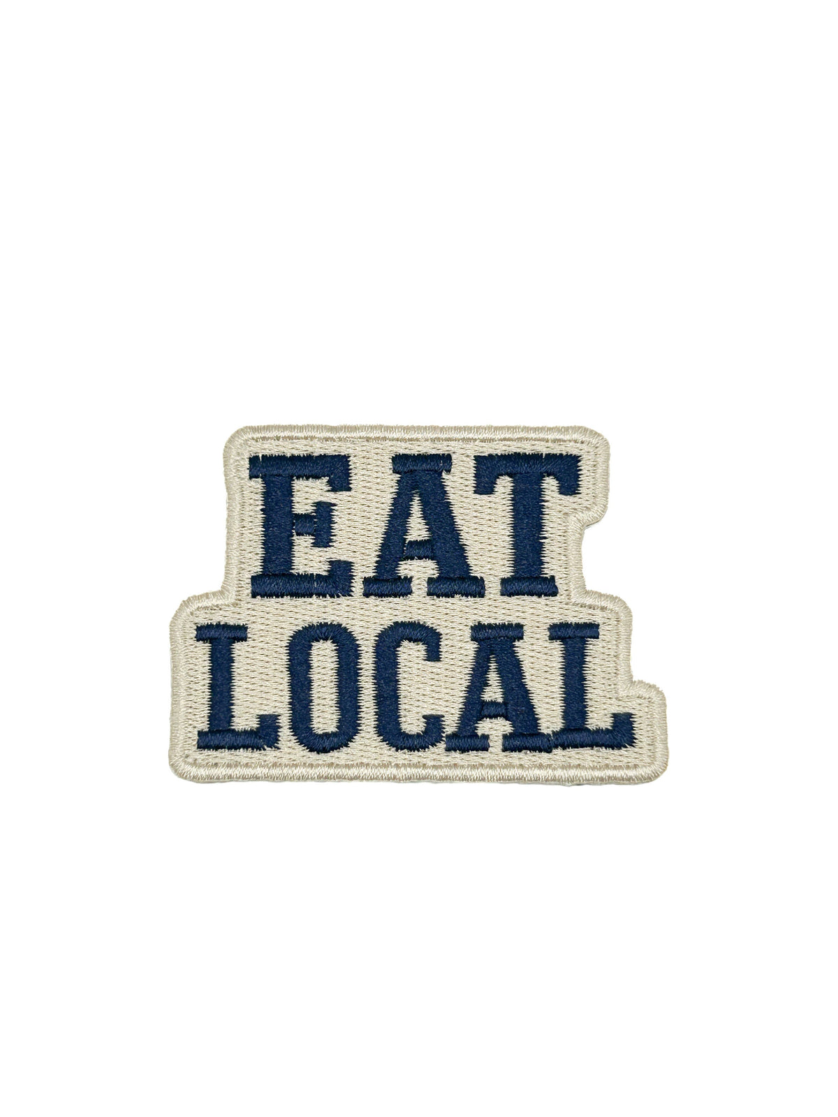 Eat Local embroidered iron-on patch with navy lettering on a cream background