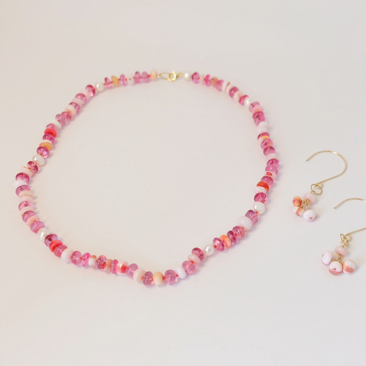 Close-up of pink topaz, pink opal, and pearl beads on the Gemmy Gem Candy Necklace
