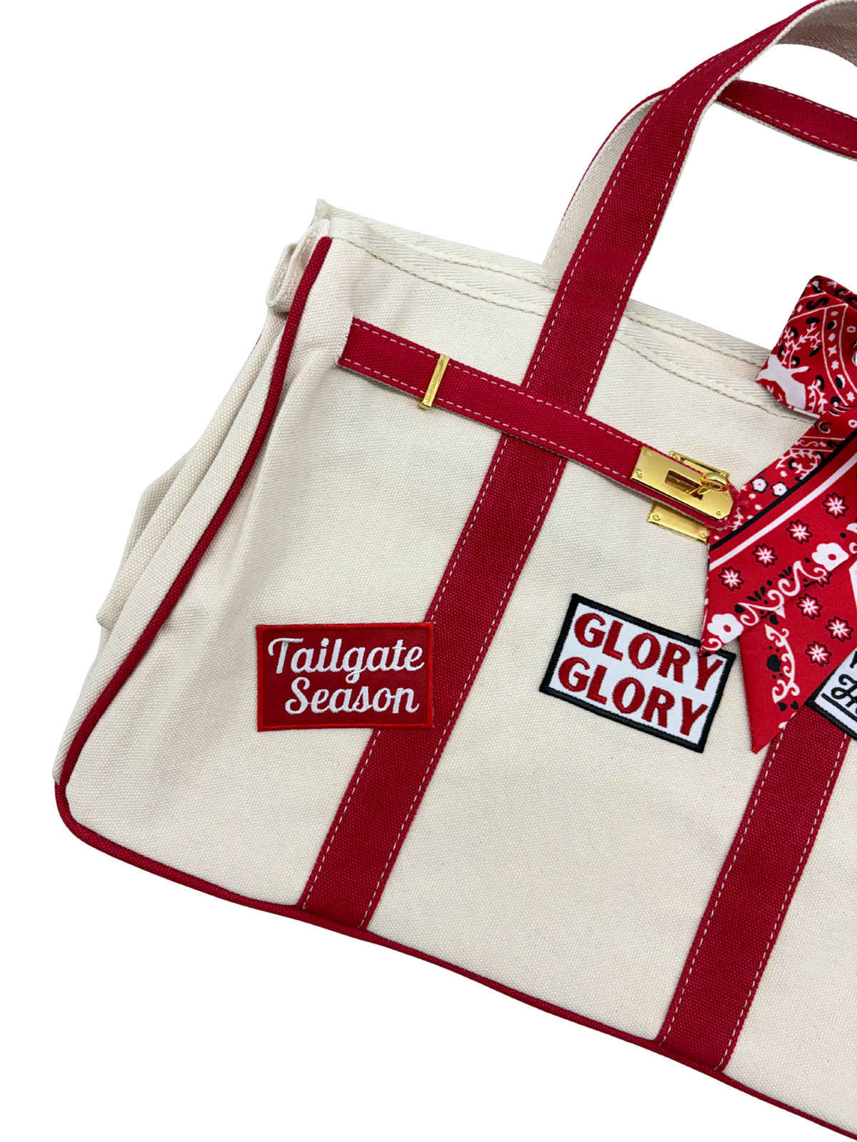 Detailed view of the left side of the Georgia Bulldogs canvas weekender tote bag showcasing embroidered Tailgate Season and Glory Glory iron on patches on beige canvas.
