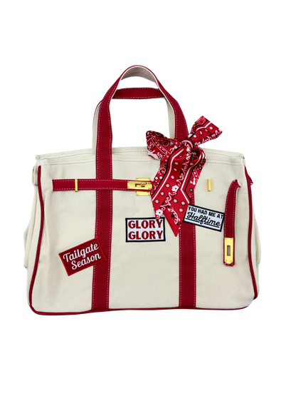Georgia Bulldogs college football tote bag with red piping, featuring iron on game day patches, a red paisley twilly scarf, and signature gold hardware.