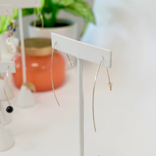 Hand-forged marquise threader earrings showing their elongated drop
