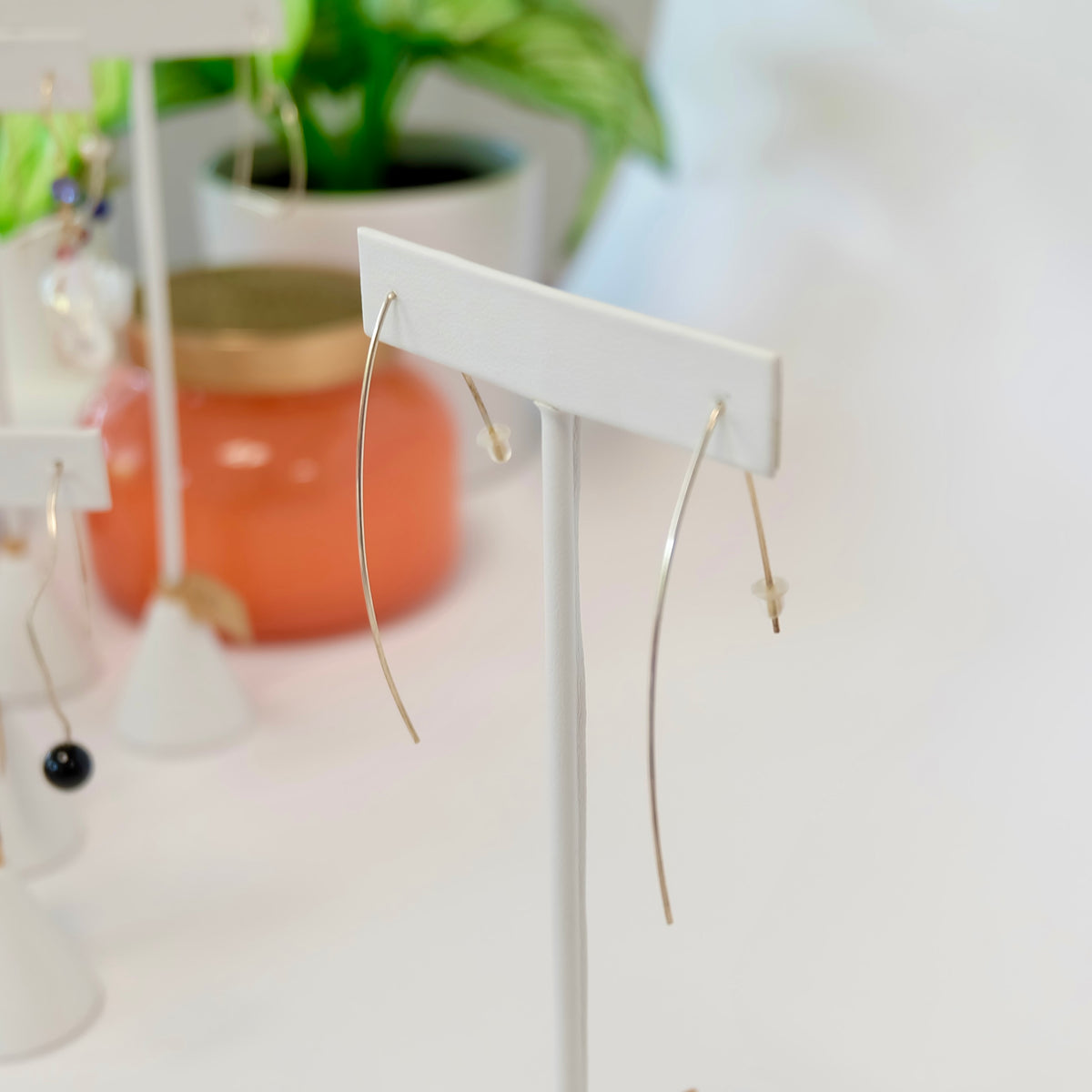 Hand-forged marquise threader earrings showing their elongated drop