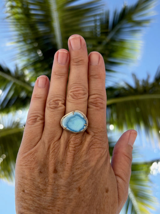 Woman's hand wearing a golden hills 14k gold turquoise ring