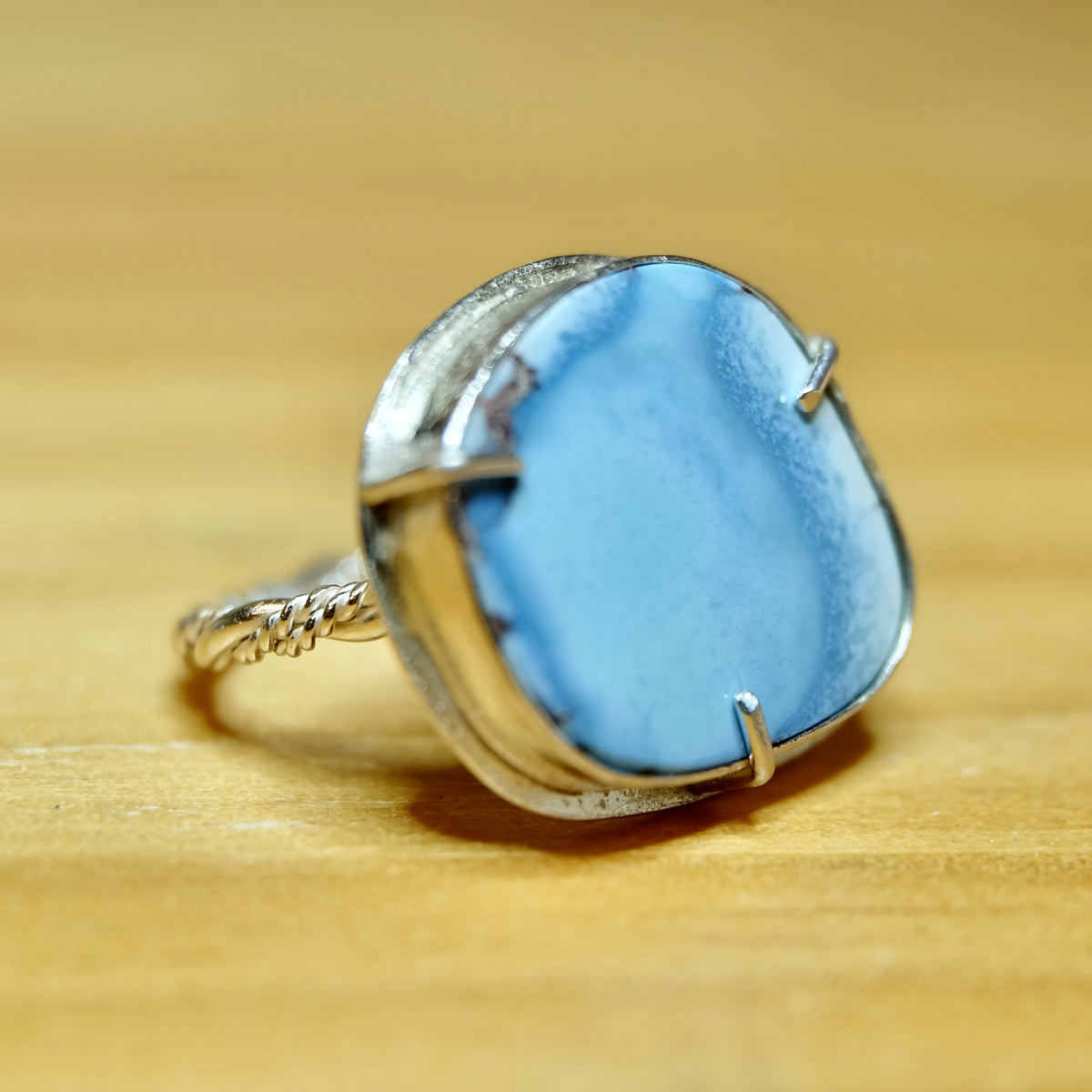 Side view of a Golden Hills lavender turquoise ring with a braided sterling silver band