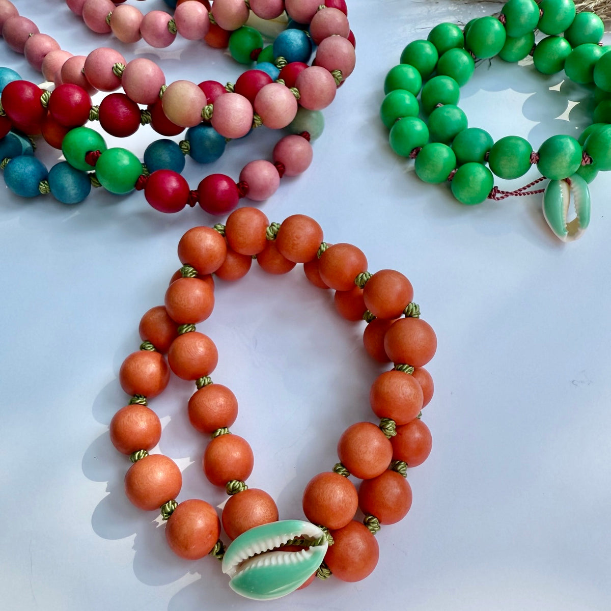 Colorful wood bead necklaces hand-knotted on silk