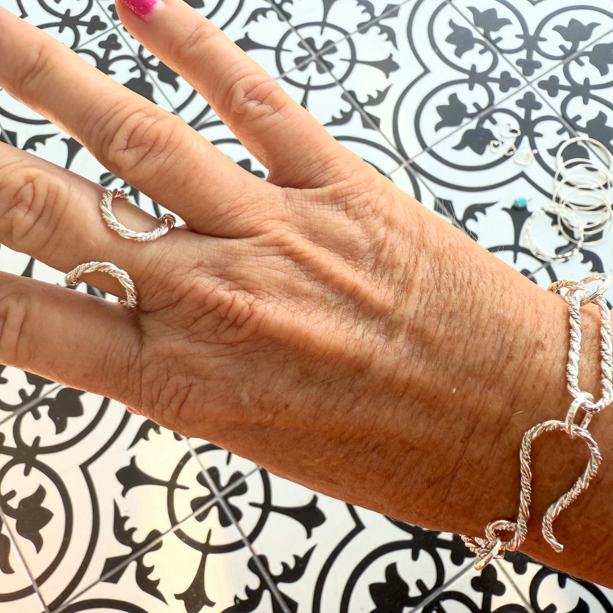 Close-up of handmade sterling silver paperclip bracelet links