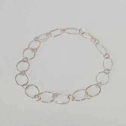Handmade sterling silver paperclip link necklace laid flat