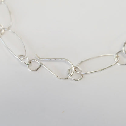 Oversized hand-forged sterling silver S-hook clasp on a paperclip link necklace