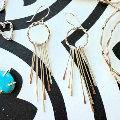 Close-up of sterling silver tassel earring strands