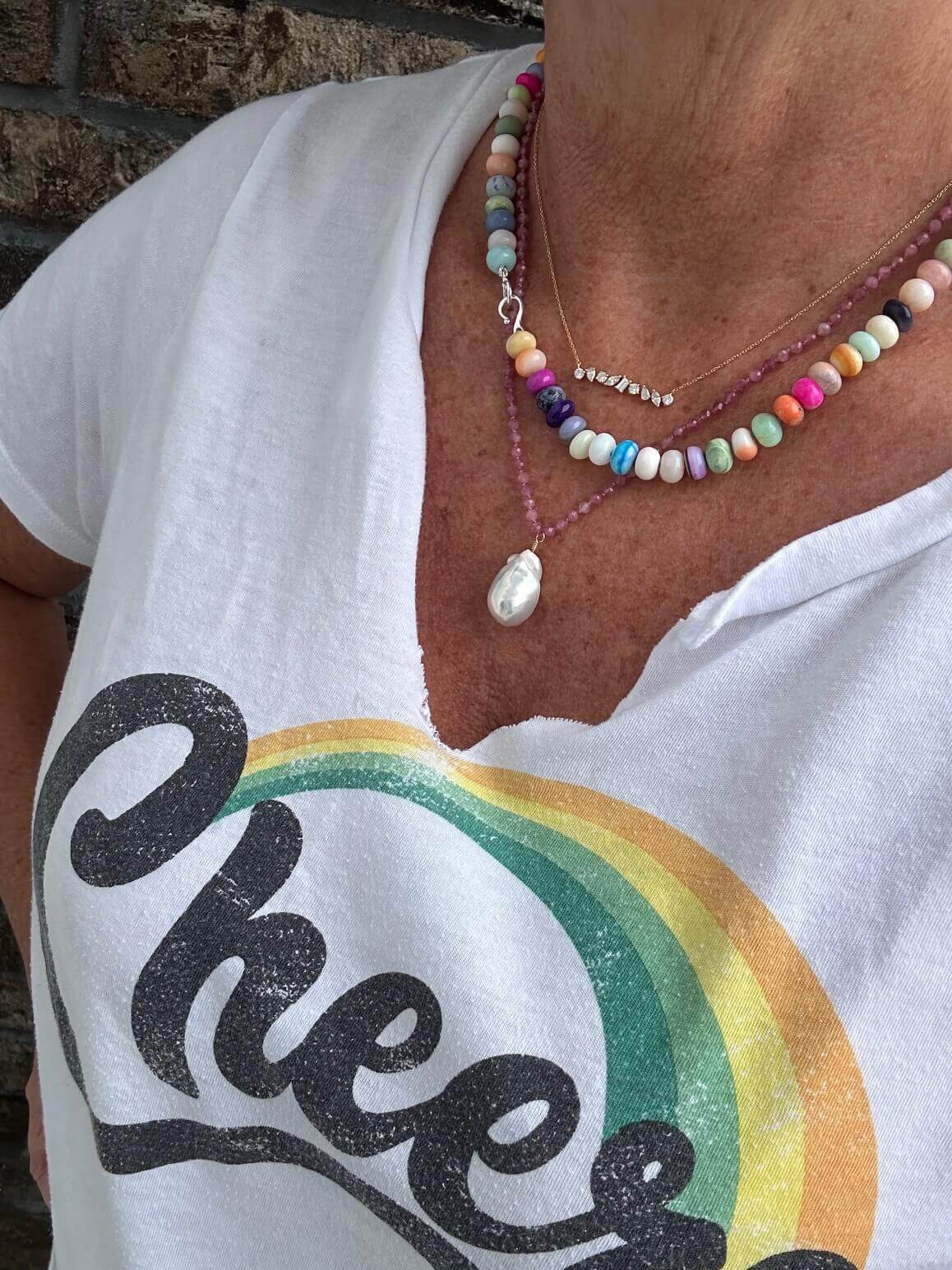 Image of happy jewelry making class customer