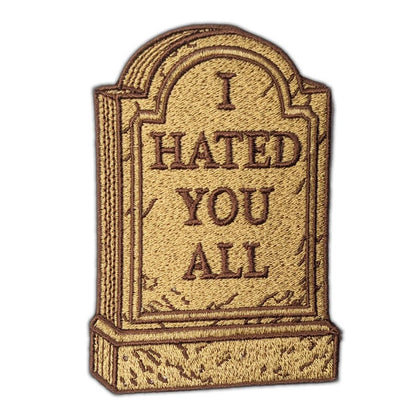 Embroidered patch of a tombstone with 'I HATED YOU ALL' text on a white background