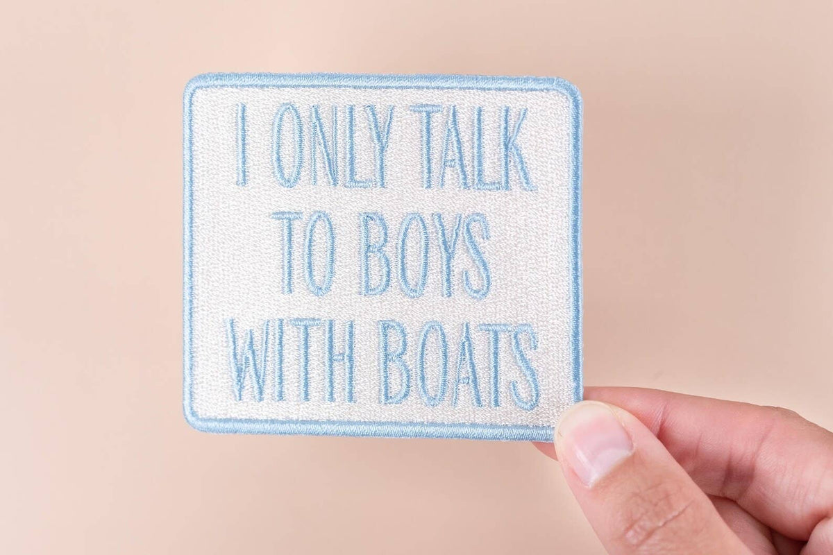 I Only Talk to Boys with Boats embroidered iron-on patch with blue text on a white background