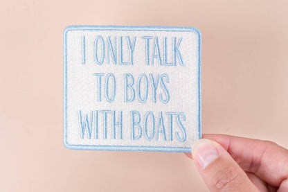 I Only Talk to Boys with Boats embroidered iron-on patch with blue text on a white background