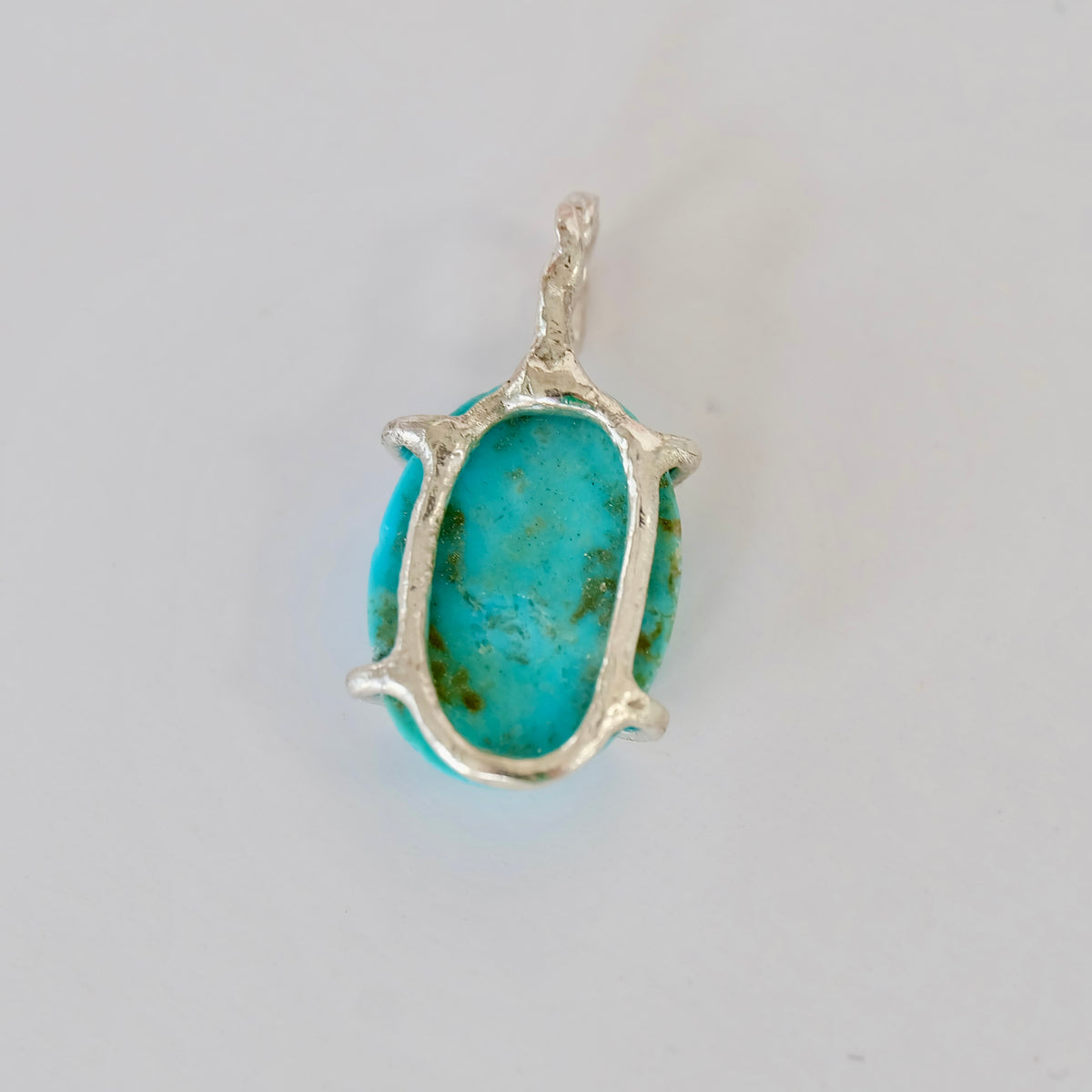 Oval Kingman turquoise charm set in sterling silver, 13 x 18mm