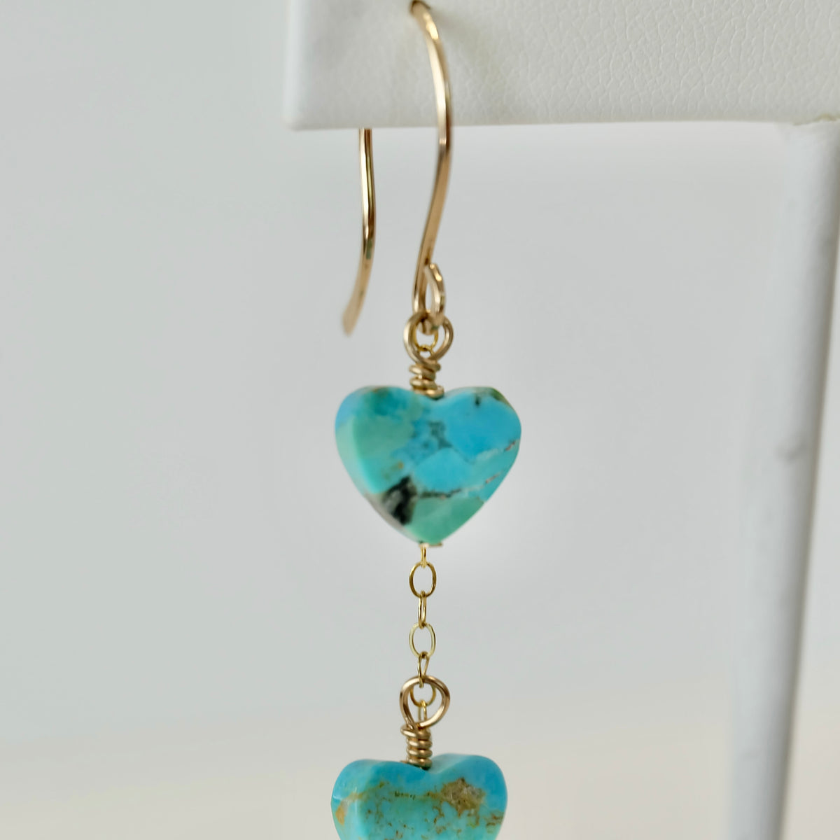 Close-up of a 10mm Kingman turquoise heart bead