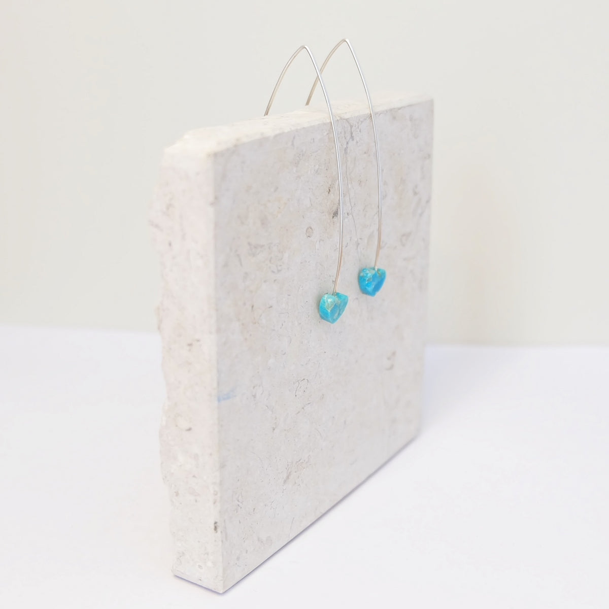 Pair of sterling silver threader earrings with Kingman turquoise hearts