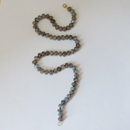 Smooth rondelle labradorite beads flashing blue on a gemston necklace with a 14K gold-filled clasp