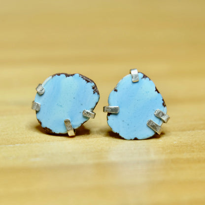 Display of Golden Hills Turquoise Stud Earrings in silver showing lavender hues 