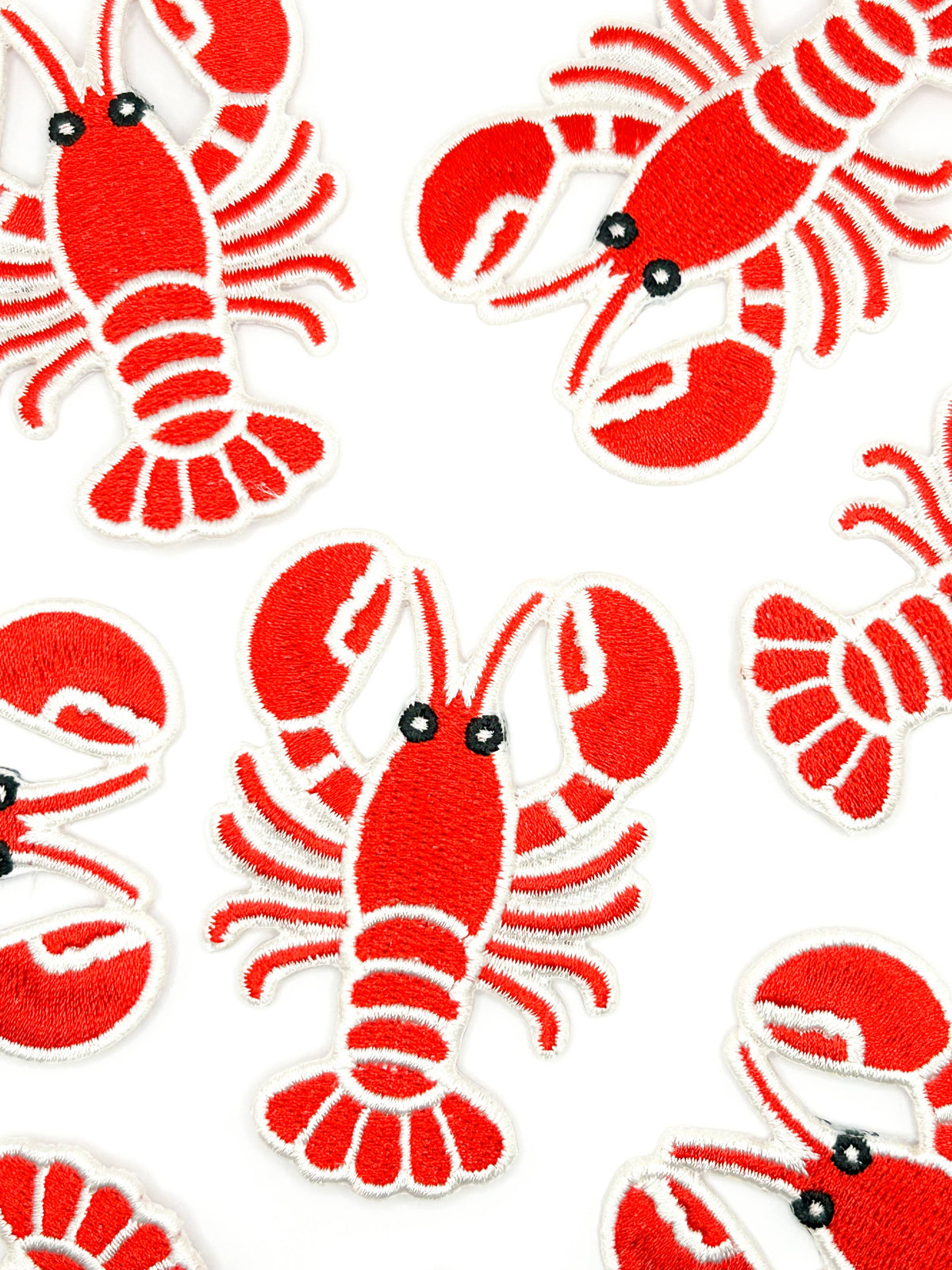 Lobster patch in bright red with white stitching