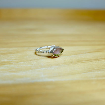 Watermelon tourmaline ring showing its pink-to-green color shift