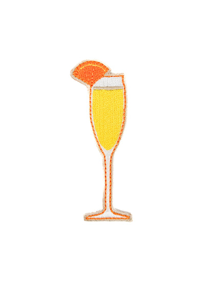 Embroidered iron-on patch of a mimosa in a champagne glass