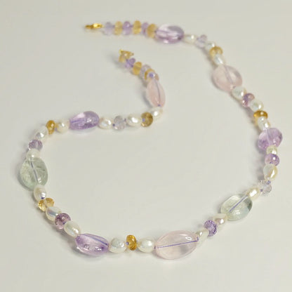 Mixed Gemstone Necklace featuring hand-knotted rose quartz, amethyst, citrine, and freshwater pearls with a 14K gold-filled clasp.