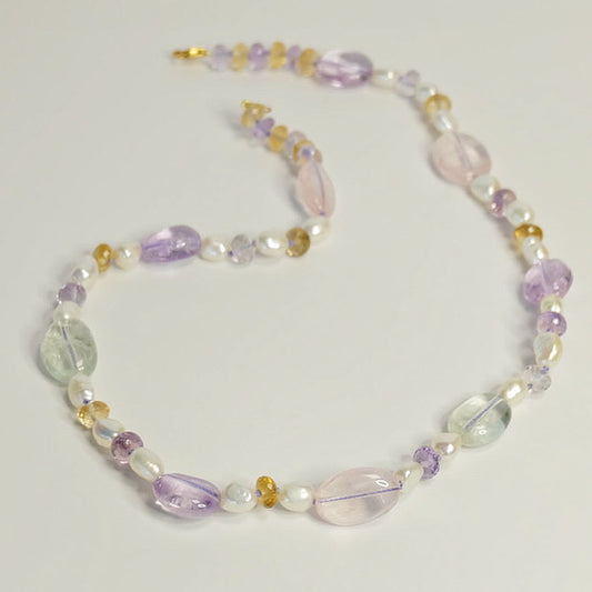 Mixed Gemstone Necklace featuring hand-knotted rose quartz, amethyst, citrine, and freshwater pearls with a 14K gold-filled clasp.