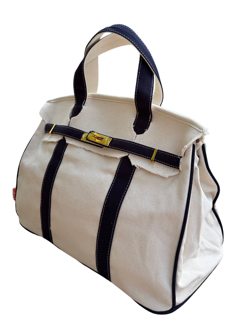 Navy blue Boatkin bag piping on a white background
