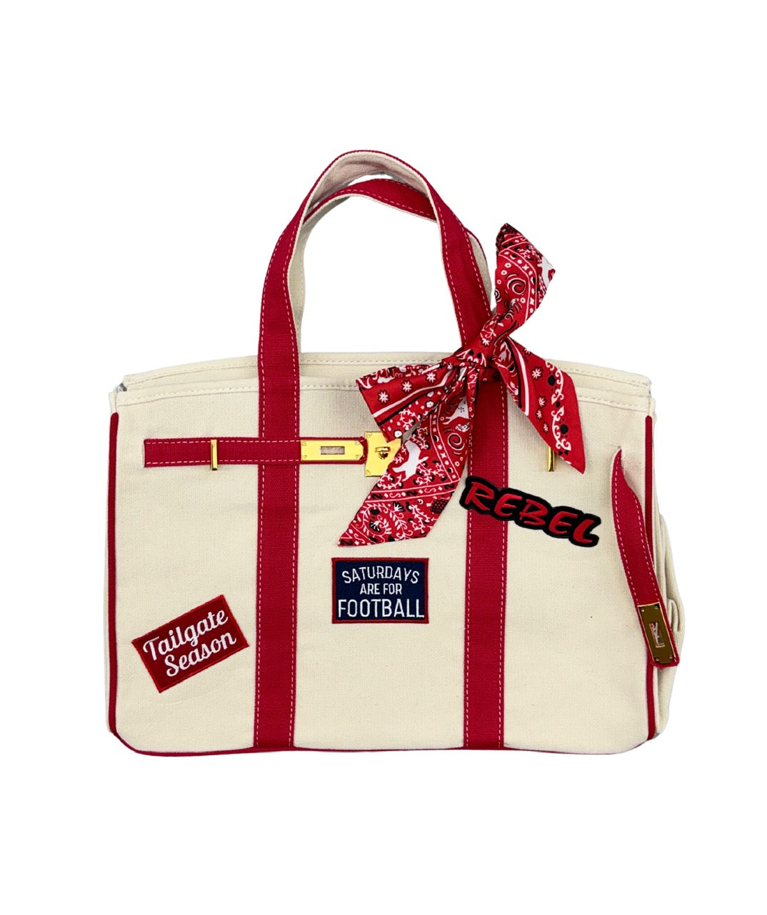 Ole Miss college football tote bag with red piping, featuring iron on game day patches, a red paisley twilly scarf, and signature gold lock and key closure.