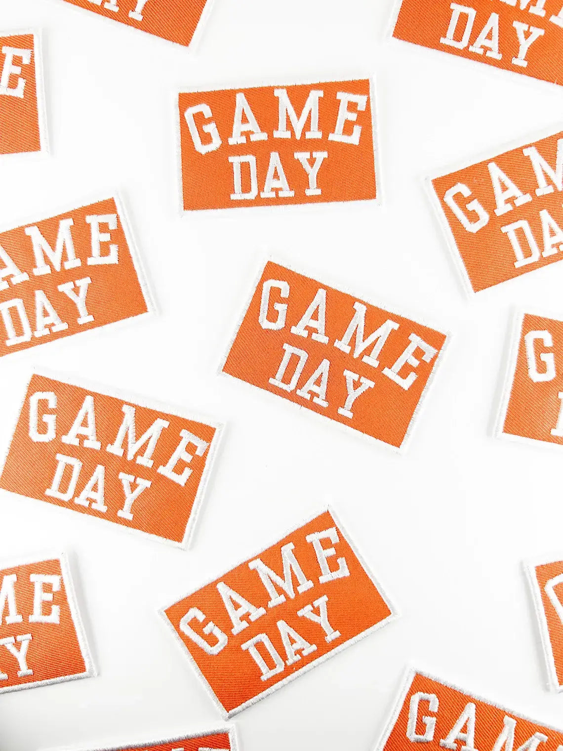 Multiple 'GAME DAY' stickers on a white background