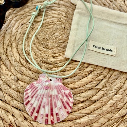 Pink fan shell pendant with pink topaz and pearl close-up