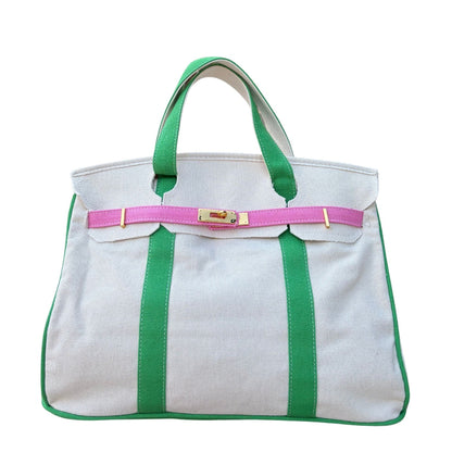 Pink and green Boatkin bag front with gold hardware on a white background