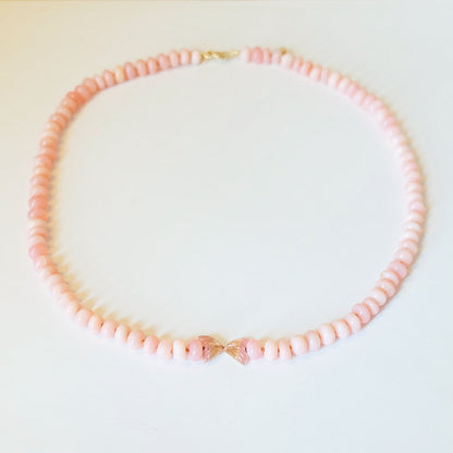 A beautiful pink opal bead necklace, crafted with lustrous beads that add a touch of sophistication to any outfit.