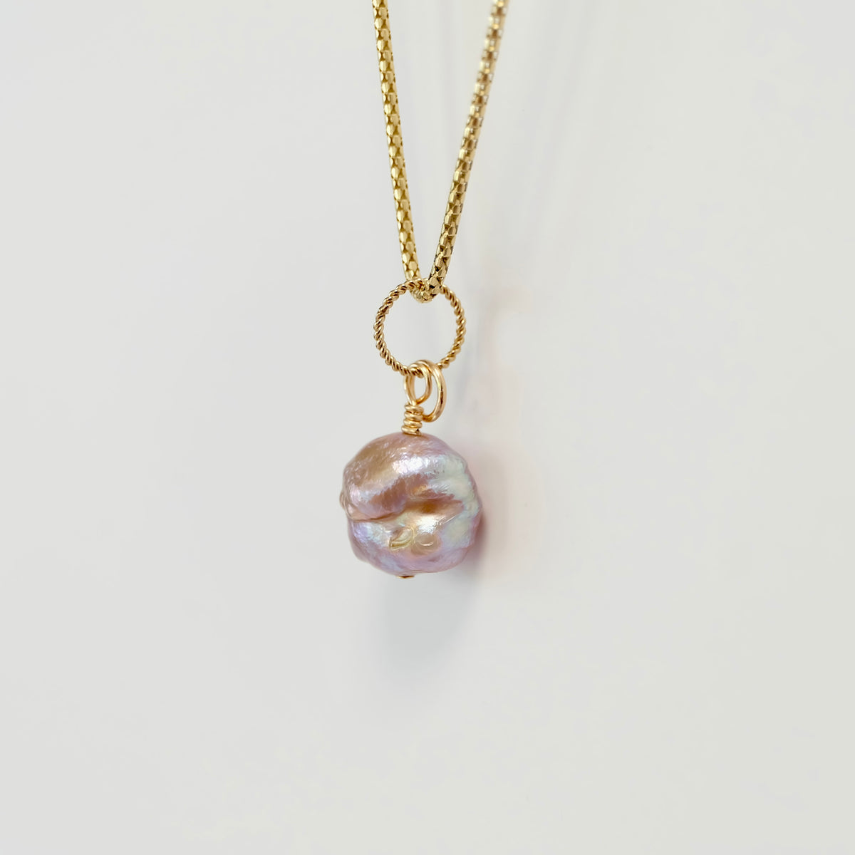 Rosebud freshwater pearl charm with a gold spring clasp