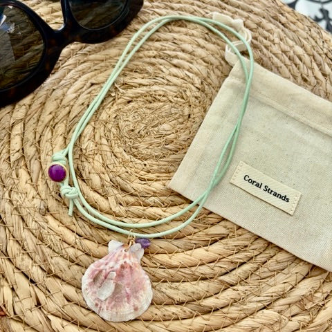 Pink fan shell pendant with amethyst and rose quartz on aqua cord, close-up