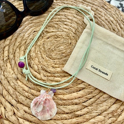 Pink fan shell pendant with amethyst and rose quartz on aqua cord, close-up