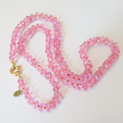 Pink topaz candy necklace with a solid 14K gold lobster clasp and quality tag