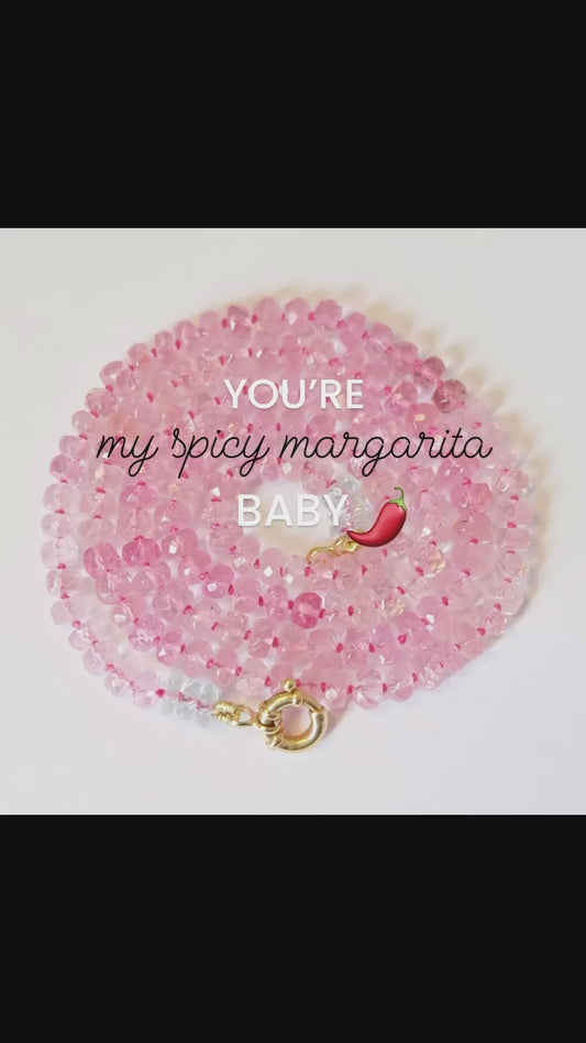Video of a pink tourmaline beaded candy necklace styled with neutral tones