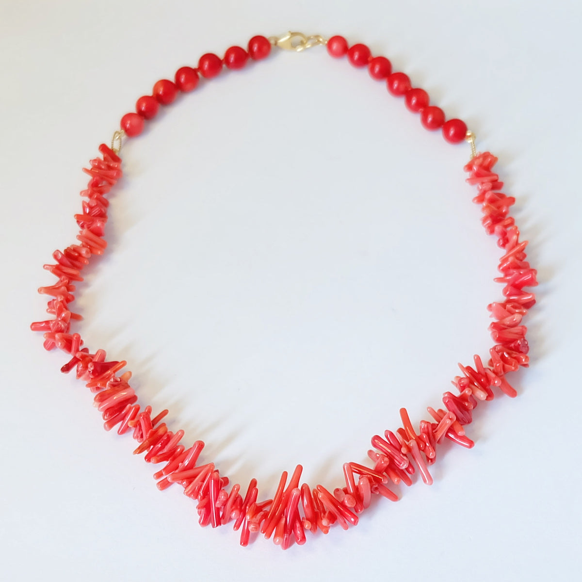 Red bamboo coral beaded necklace with coral sticks and a 14K gold-filled clasp