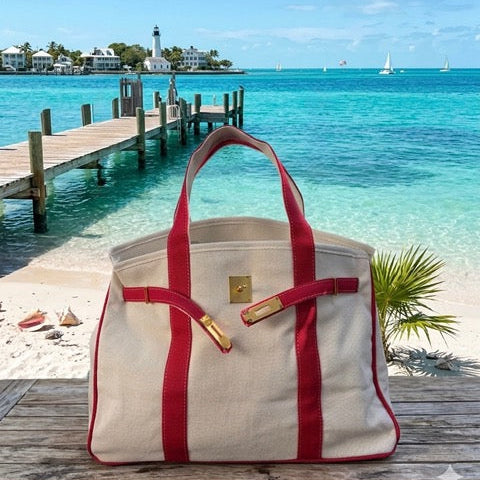 Red Boatkin bag with a beach in the background